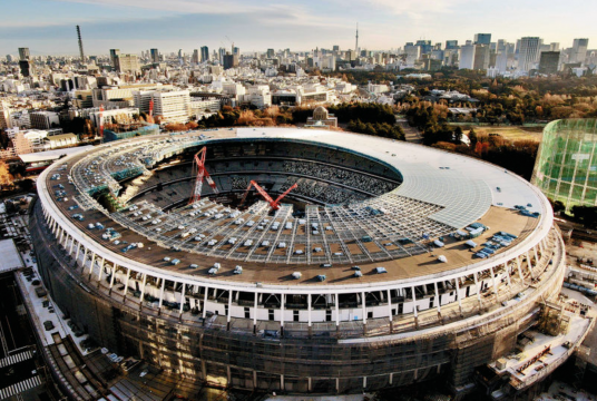 The New National Stadium is seen under construction on Monday in Shinjuku Ward, Tokyo./Photo credit: The Japan News