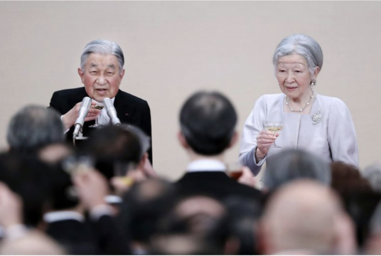 The Emperor and Empress raise their glasses for a toast during a gathering held at the Imperial Palace in Tokyo on Tuesday to commemorate the Emperor’s 30-year reign./Jiji Press