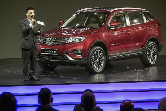 Proton chief executive Li Chunrong announcing prices of the Proton X70 sport utility vehicle during its launch last December.PHOTO: EPA-EFE