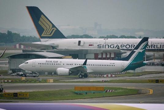  A SilkAir Boeing 737 Max 8 plane at Changi Airport yesterday. The carrier currently flies this aircraft - whose operation has been suspended by Singapore - to places like Bengaluru, Cairns and Chongqing.ST PHOTO: CHONG JUN LIANG