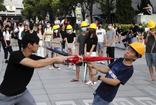 Students practising self-defence moves at the Chinese University of Hong Kong in Sha Tin yesterday. Beijing says protesters have become "foot soldiers" of foreign forces bent on destabilising the city and the mainland. PHOTO: ASSOCIATED PRESS