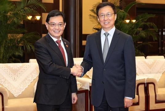 Deputy Prime Minister Heng Swee Keat (left) and Chinese Vice-Premier Han Zheng meeting yesterday in China's south-western city of Chongqing. Singapore and China signed a raft of pacts at the 15th Joint Council for Bilateral Cooperation meeting.PHOTO: MCI