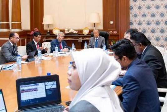 Dr Mahathir in discussion with top officials from the Treasury on Wednesday.