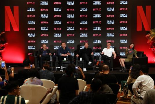 Producer Chuck Roven, far left, and actors Affleck, Hunnam and Hedlund during the recent press conference in Singapore/Courtesy of Netflix