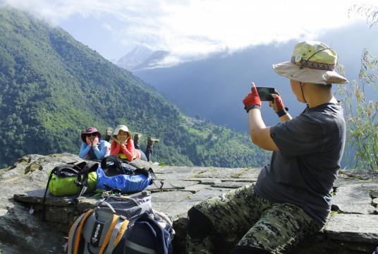 Chinese tourists are seen taking photos on the route to Annapurna Base Camp. Post File