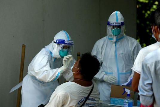 Swab tests being taken from highway drivers and helpers leaving Yangon Region (Photo-Myo Htet Paing)