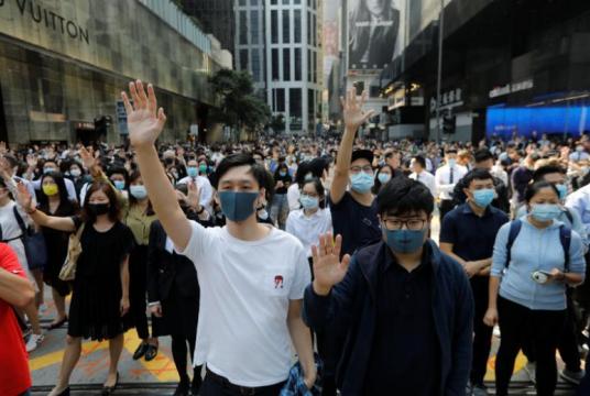Demonstrators raise their hands as they take to the streets during a protest at the Central District in Hong Kong, on Nov 15, 2019.PHOTO: REUTERS