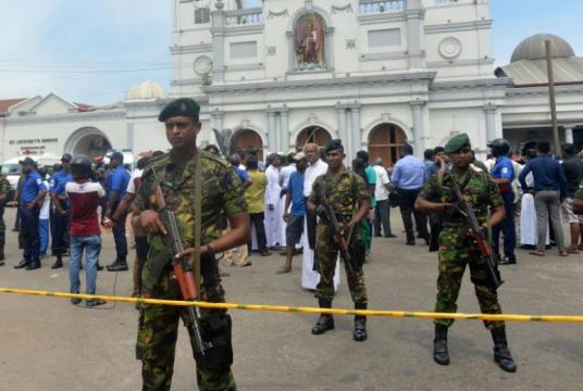 Sri Lankan security personnel standing guard outside St Anthony's Church in Kochchikade, after it was hit by an explosion, on April 21, 2019.PHOTO: AFP