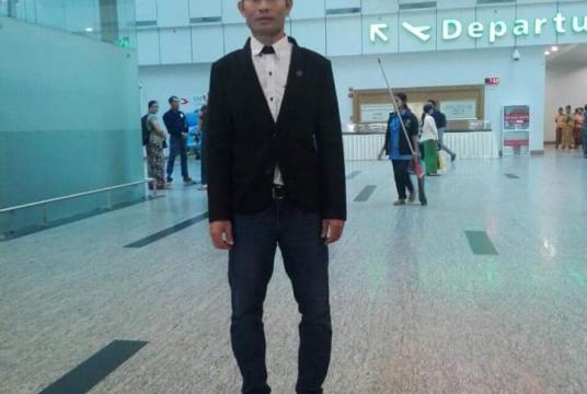 U Zin Myo Aung poses for a single photo before departure at Yangon International Airport. (MFF)