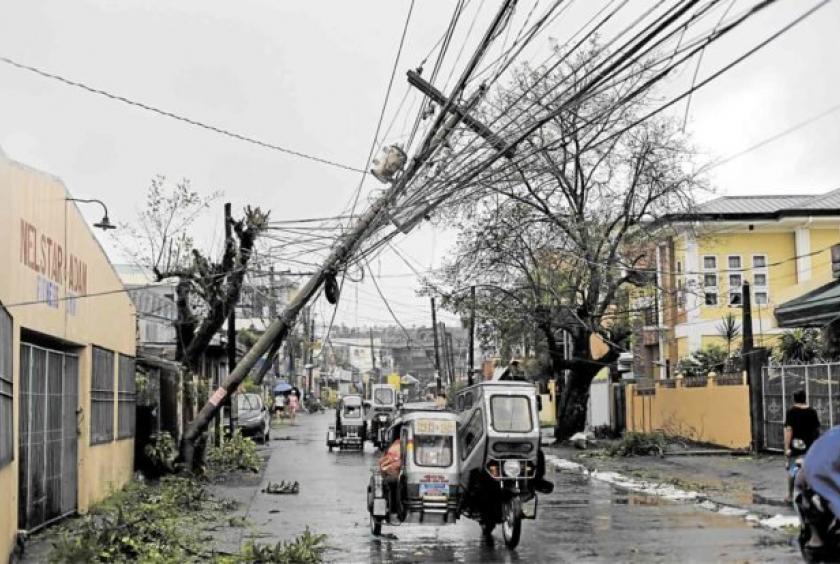 POWERFUL WINDS This electric post in Daraga town in Albay province proved no match for the powerful winds generated by Typhoon “Tisoy” as the storm blew across the Bicol region on Monday night. Tisoy left swaths of the region without electricity on Tuesday. —GEORGE GIO BRONDIAL