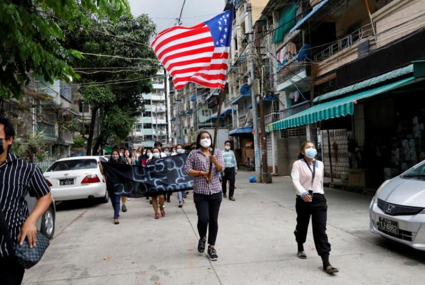 People march with the federal flag as they support National Unity Government (NUG) which has been recently announced in Yangon, Myanmar April 18, 2021. - Rreuters