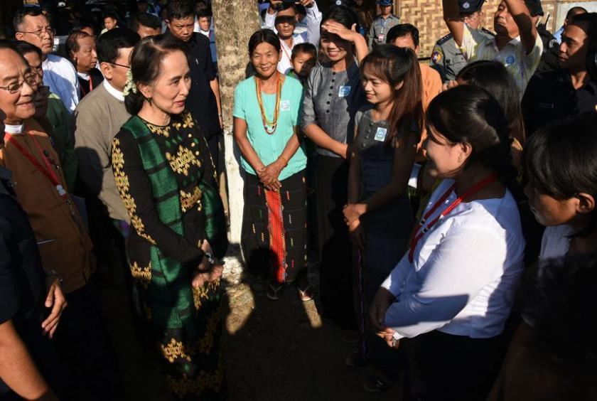 State Counsellor Daw Aung San Suu Kyi meeting with people at Ingyandon Baptist IDP camp in Thatkon Ward in Myitkyina yesterday. Photo:MNA