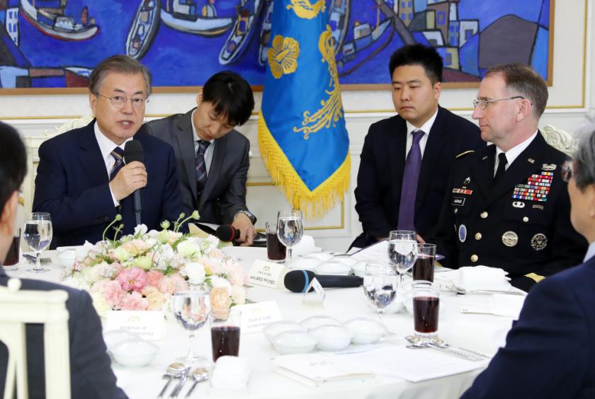 President Moon Jae-in speaks during a meeting with senior US and South Korean military commanders, including Gen. Robert Abrams (right), chief of the US Forces Korea, at the presidential office on Tuesday. Yonhap
