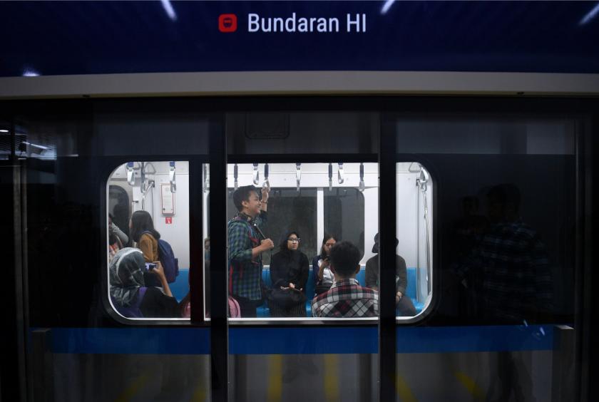 Members of the public ride the MRT Jakarta on March 12, 2019, the first day of the trial run for the new mass transit system. (Antara/Sigid Kurniawan)