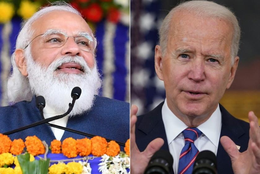 This combination of pictures created on April 26, 2021 shows a handout photograph taken on December 15, 2020 and released by the Indian Press Information Bureau (PIB) of Prime Minister Narendra Modi during the foundation stone ceremony of various development projects in Kutch. and a file photo taken on April 2, 2021, of US President Joe Biden(R) speaking in the State Dining Room of the White House in Washington, DC. (AFP/Mandel Ngan/Indian Press Information Bureau)