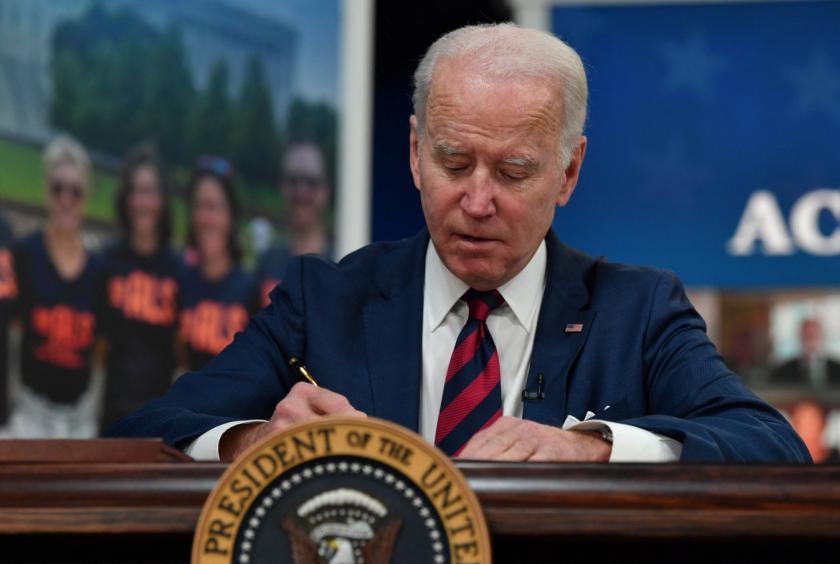 President Joe Biden signs the National Defense Authorization Act (NDAA