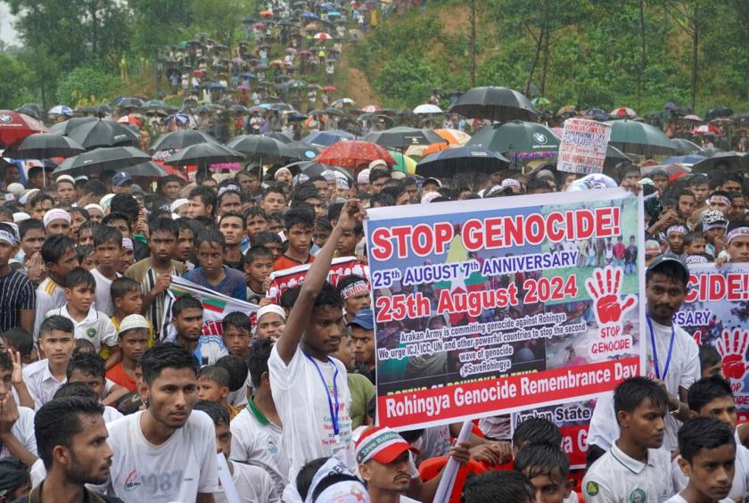 Rohingya refugees gather to mark the seventh anniversary of their fleeing from neighboring Myanmar to escape a military crackdown in 2017 during heavy monsoon rains in Cox's Bazar, Bangladesh on Aug. 25, 2024. (Reuters/Mokammel Mridha)