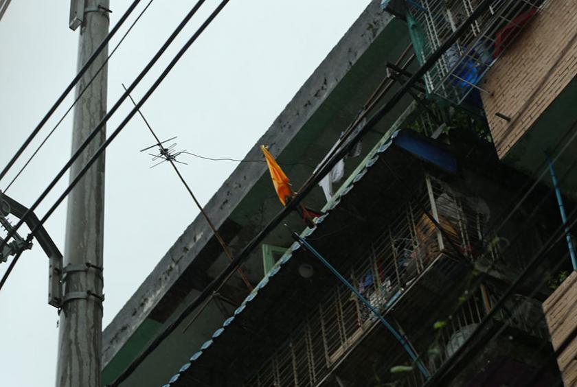 A flat in Marlarnew Street in Tamwe Township is seen raised a yellow flag on July 20