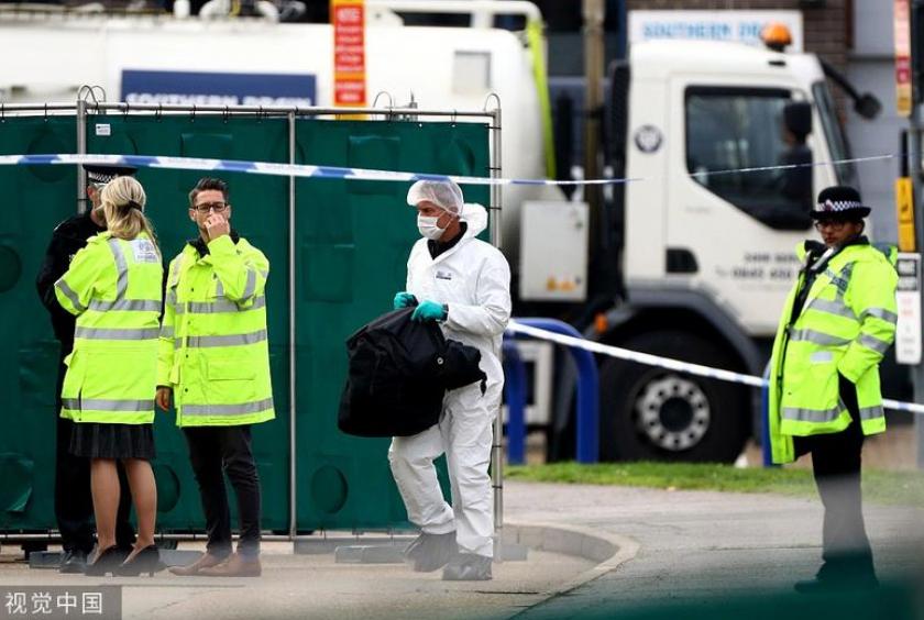 Police officer are seen at the scene where bodies were discovered in a truck in Grays, Essex, Britain Oct 23, 2019. [Photo/VCG]