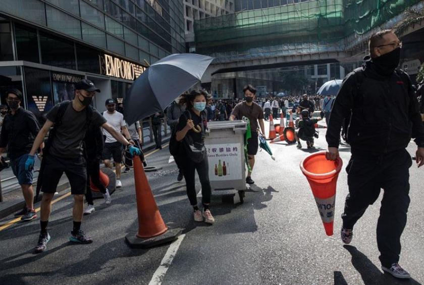 Protesters create makeshift barricades during a demonstration in the Central district of Hong Kong, on Nov 11, 2019 (NICOLE TUNG / BLOOMBERG)