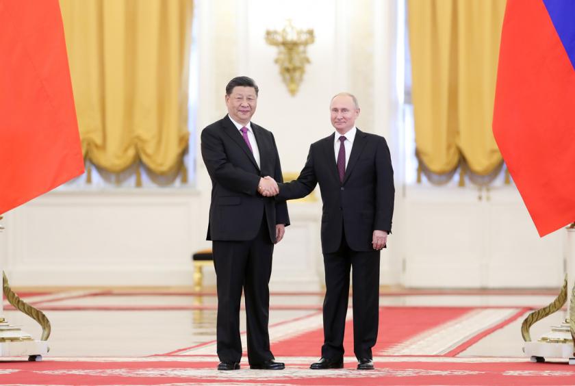 President Xi Jinping and Russian President Vladimir Putin meet in Kremlin after Xi's arrival in Moscow on Wednesday. Xi is paying a three-day state visit to the country. [Photo/Xinhua ]