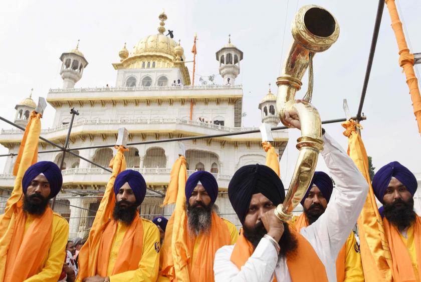 In pictures: Pakistan welcomes scores of Sikh pilgrims to Gurdwara Darbar Sahib in landmark ceremony