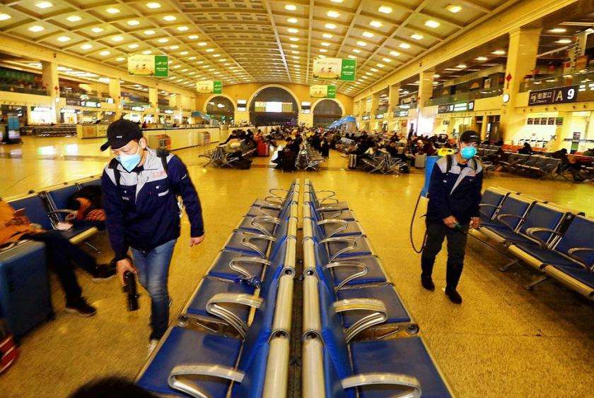 Apart from strict measures taken in hospitals, other places including railway stations are using infection prevention and control workers to disinfect public facilities such as Wuhan's Hankou Railway Station (above) in Hubei province. YUAN ZHENG/FOR CHINA DAILY
