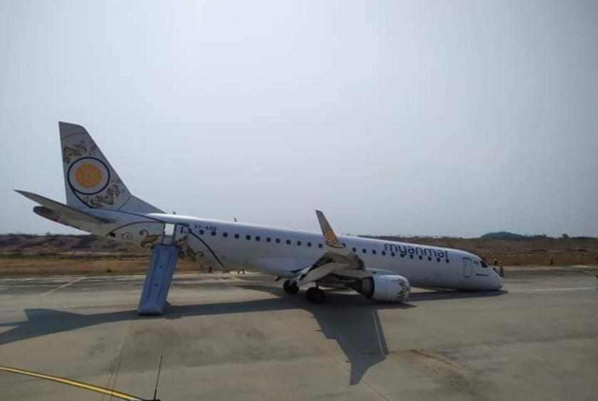 The MNA flight seen at Mandalay TadaU Airport after a belly landing. (Photo: Aung Thura’s facebook)
