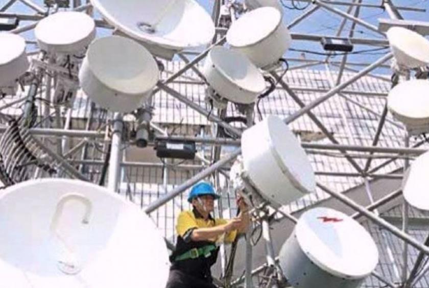 A technician carries out maintenance work at one of Indosat Ooredoo’s base transceiver stations (BTS) in Jakarta. RICKY YUDHISTIRA/THE JAKARTA POST
