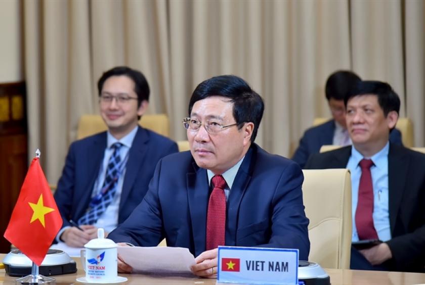 Deputy Prime Minister and Foreign Minister Phạm Bình Minh attends the Ministerial Video-Conference of the Alliance for Multilateralism on COVID-19 in Hanoi on Thursday. — VNA/VNS Photo 