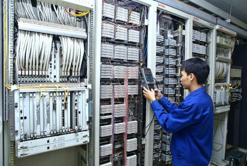 A technician checks telecoms equipment at the Telecommunication Center of Việt Nam Posts and Telecommunications Group (VNPT) in the northern province of Lai Châu.