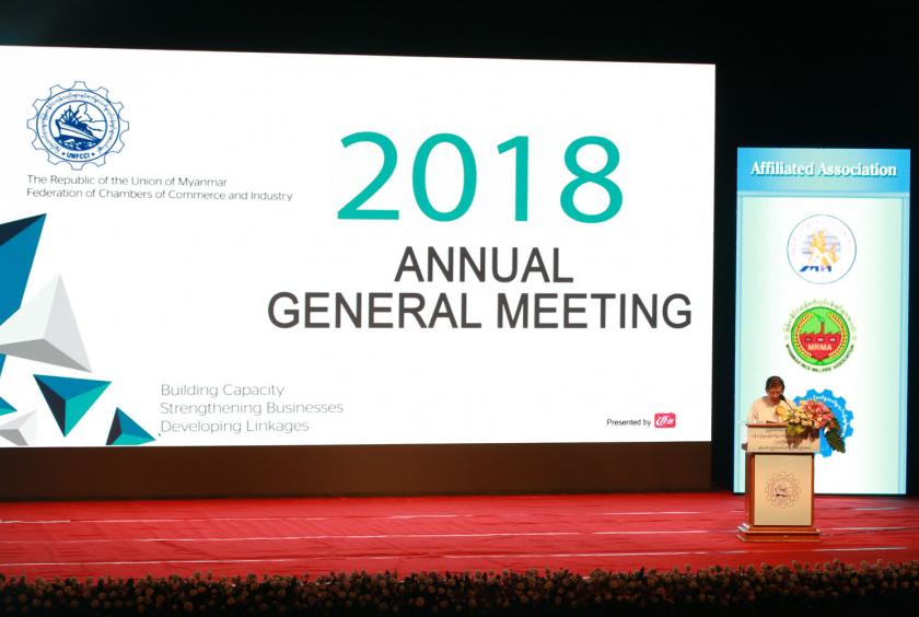 Zaw Min Win, President of Union of Myanmar Federation of Chambers of Commerce and Industry, gives a speech at the 27th annual general meeting.
