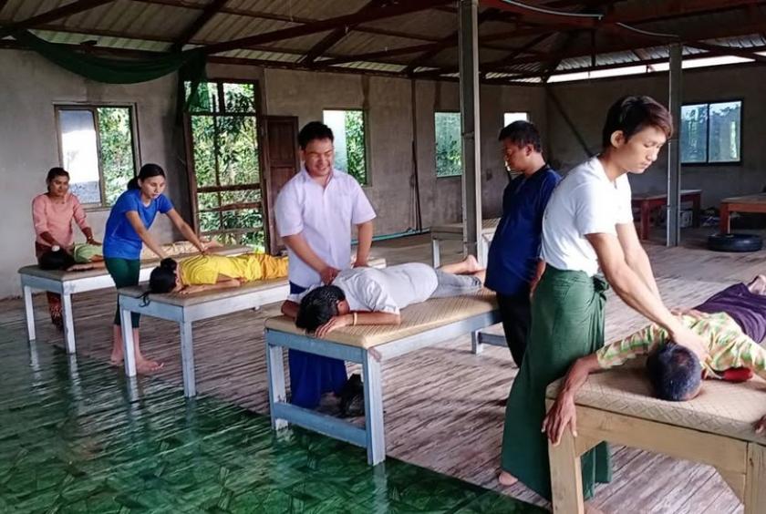 Photo Caption: Blind massage therapists receiving training on massage techniques (Photo: Myanmar National Association of the Blind).