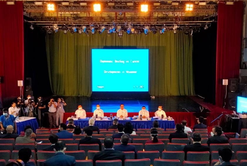 International diplomats are seen at a press conference in Myanma Radio and Television (MRTV) in Yangon on September 9.