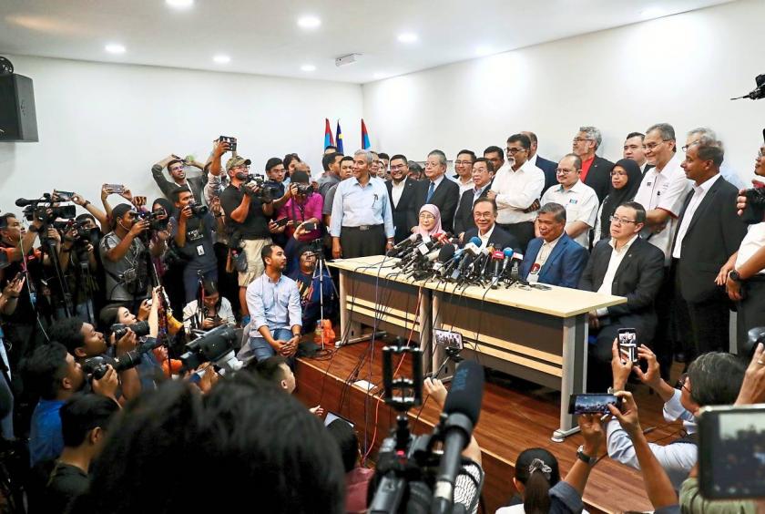 In solidarity: Anwar speaking during a press conference at PKR’s headquarters in Petaling Jaya. With him are (seated from left) Datuk Seri Dr Wan Azizah Wan Ismail, Parti Amanah Negara president Mohamad Sabu and DAP secretary-general Lim Guan Eng.