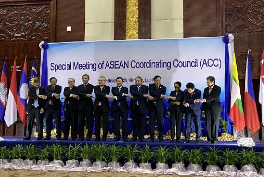 The foreign ministers of the 10 ASEAN member states and ASEAN Secretary-General Lim Jock Hoi (right) link hands on Feb. 20, 2020 at the 19th ASEAN-China summit to mark the 25th anniversary of the regional grouping's dialogue with the Asian superpower in Vientiane, Laos. (AFP/Dene-Hern Chen)