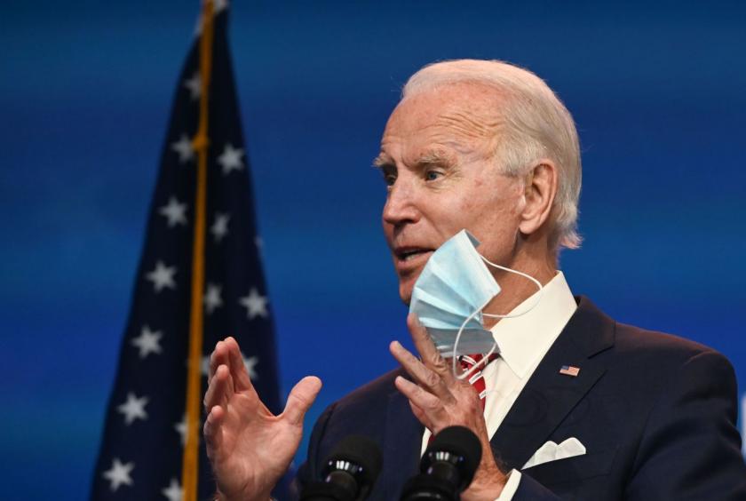 US President-elect Joe Biden shows a face mask as he answers questions about COVID 19 from the press at The Queen in Wilmington, Delaware on Monday. (AFP-Yonhap)