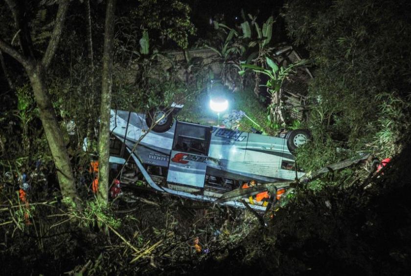 The bus carrying 66 passengers was travelling on a winding, poorly lit road when it plunged down the 20m ravine.PHOTO: AFP