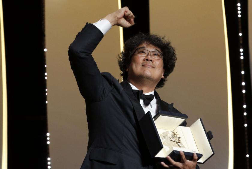 Korean director Bong Joon-ho reacts after being named as Palme d'Or award winner for his film "Parasite" (Gisaengchung) at the Cannes film festival on Saturday. (Reuters-Yonhap)