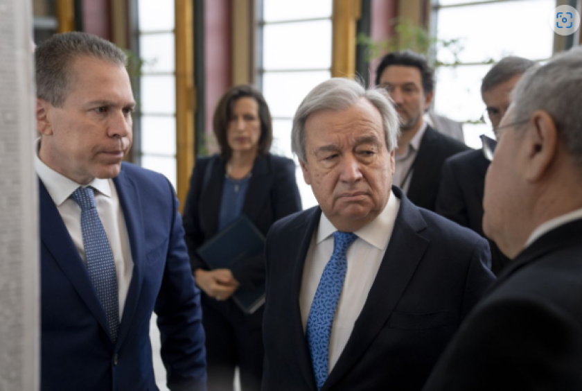(From left), Gilad Erdan, Permanent Representative of Israel to the United Nations, Antonio Guterres, United Nations Secretary General, and Dani Dayan, Chairman of Yad Vashem, browse the Yad Vashem Book of Names of Holocaust Victims Exhibit, Thursday, Jan. 26, 2023, at United Nations headquarters. - AP