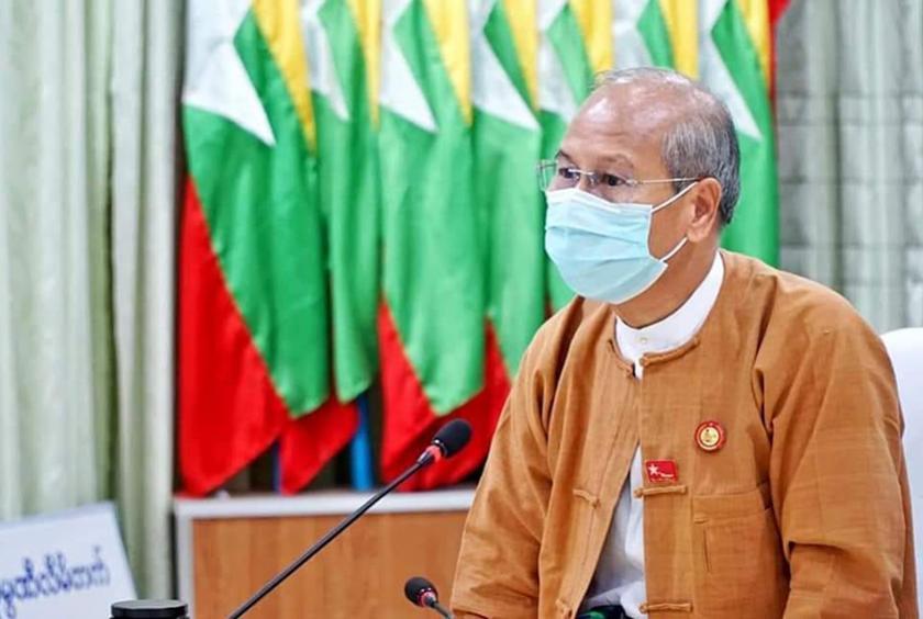 Former Magway Region chief minister Dr Aung Moe Nyo seen speaking at a ceremony