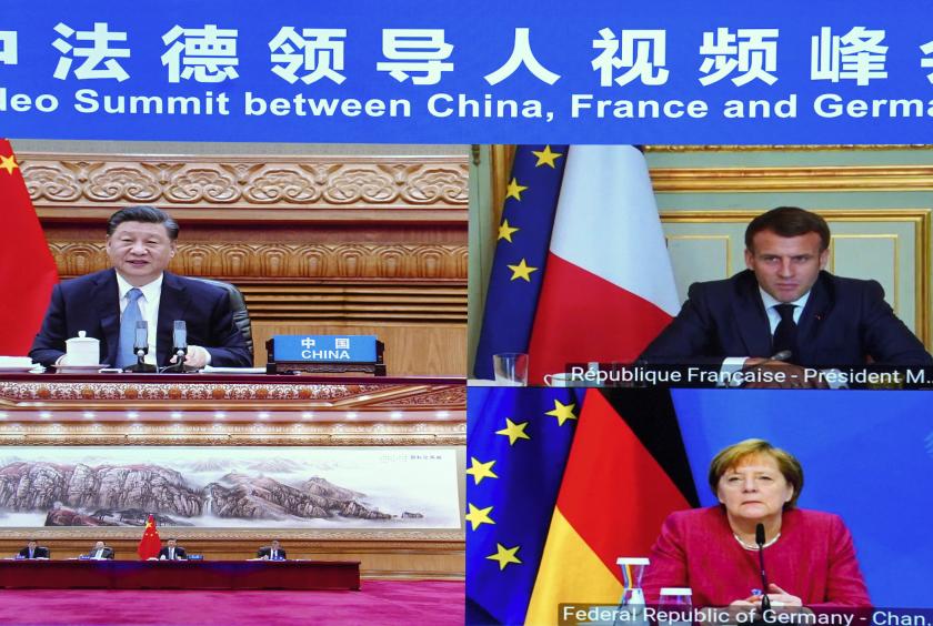 President Xi Jinping and French President Emmanuel Macron and German Chancellor Angela Merkel take part in a virtual summit on climate issues on Friday. They agreed to work on an equitable and reasonable climate governance mechanism and make it a pillar of Sino-EU cooperation. YUE YUEWEI/XINHUA