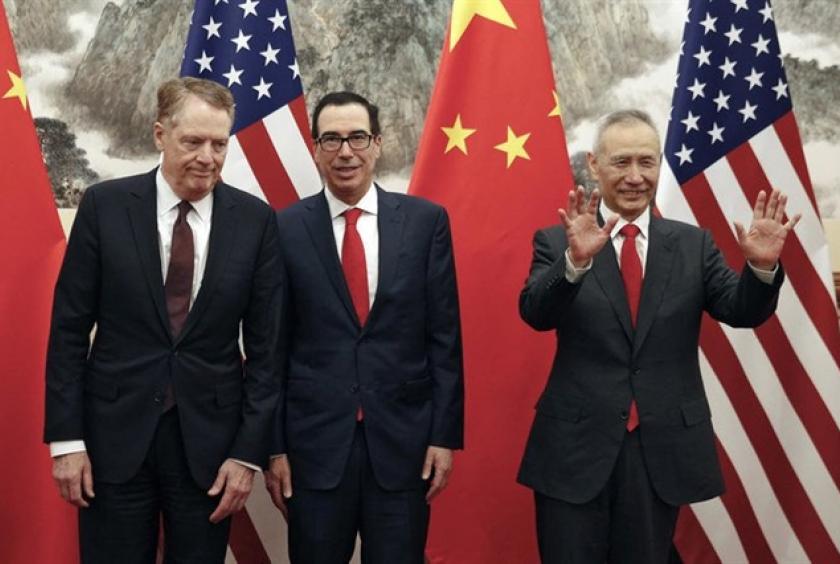 Chinese Vice Premier Liu He, right, gestures as US Treasury Secretary Steven Mnuchin, center, chats with his Trade Representative Robert Lighthizer before they proceed to their meeting at the Diaoyutai State Guesthouse in Beijing on May 1, 2019.  — AFP File Photo 