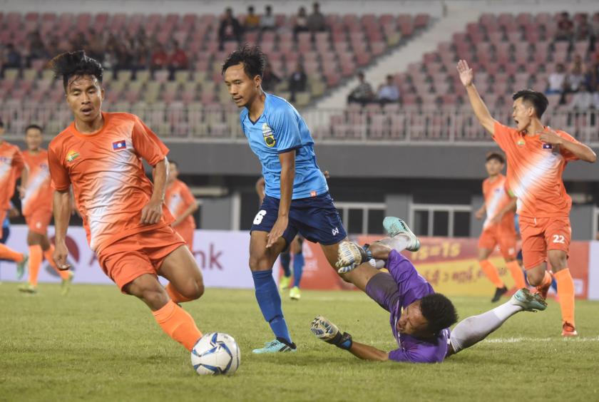 Laos’s defender and goalkeeper blocked the attack from Myanmar team (Photo-Nyi Nyi Soe Nyunt)