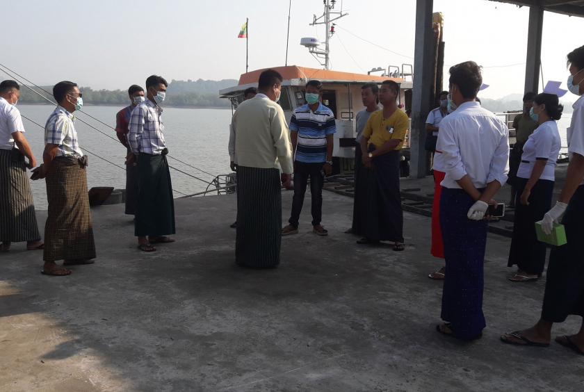 Officials met with crewmen from a cargo ship from Malaysia in Myeik port