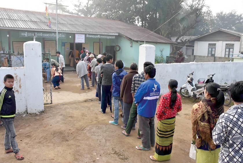 Voters seen at a polling station in Lecha Township