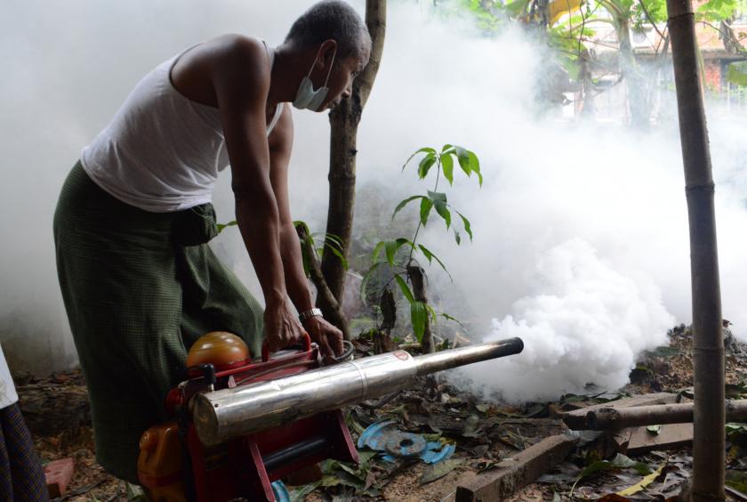 Health worker fumigates as a dengue fever preventive measure in Bahan Township, Yangon, last year. (Photo-Ei Thinzar Kyaw)