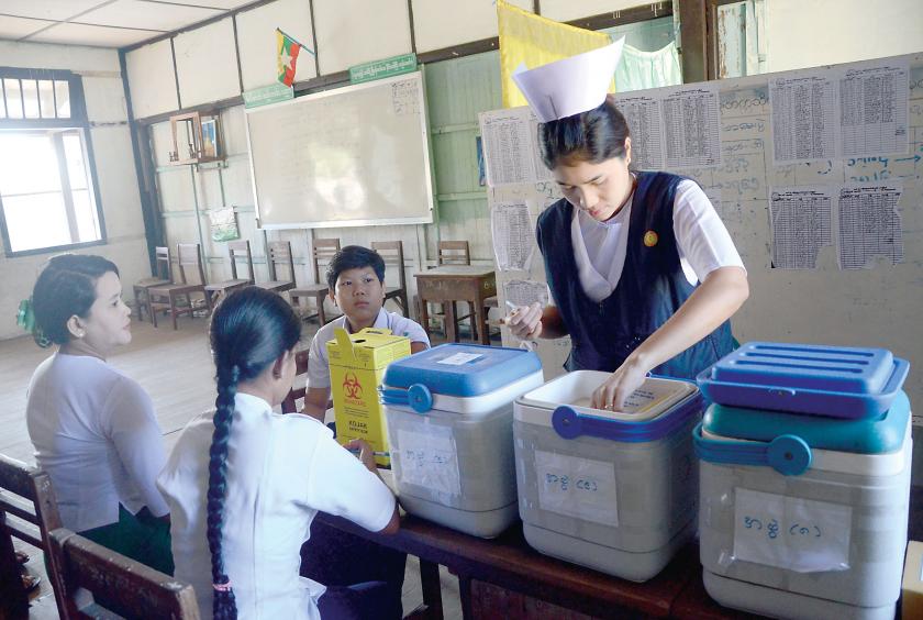 The collective measles-rubella vaccination program at a school in 2015. (Photo -Kyi Naing)