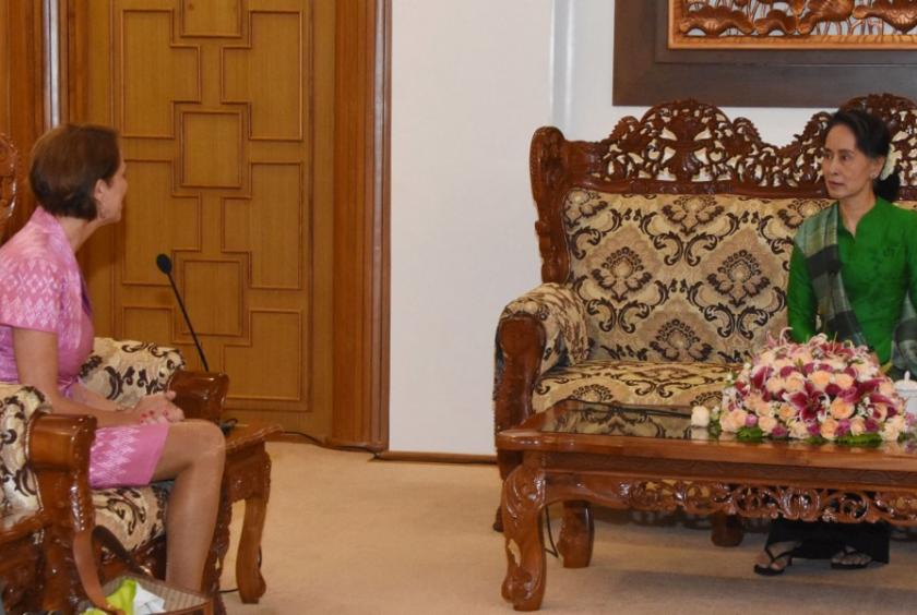 This handout picture released and taken by the Ministry of Information on June 13, 2018 shows Myanmar State Counsellor Aung San Suu Kyi (right) receiving new UN envoy Christine Schraner Burgener (left) during a courtesy call at the Ministry of Foreign Affairs in Naypyidaw on June 13, 2018. (AFP/Handout)