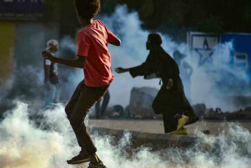 Youths in Khartoum confront security forces firing tear gas following a military coup - AFP/File